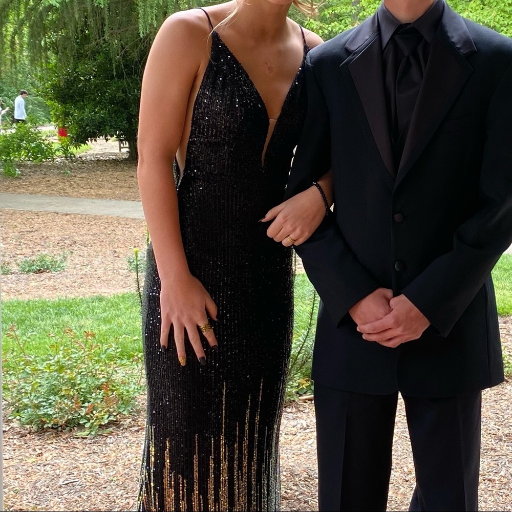 Black and gold sequined fitted dress